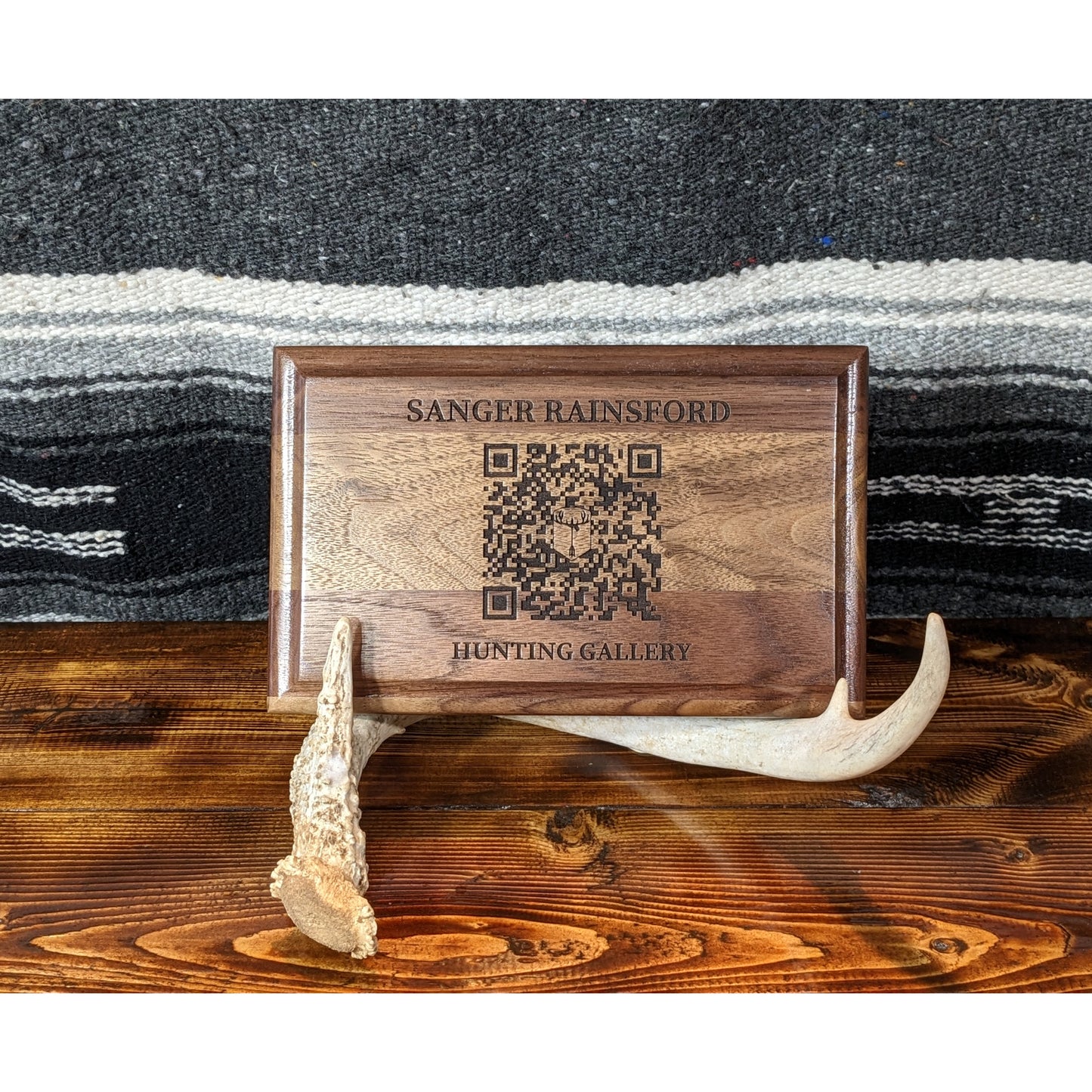 Black Walnut wood TAGSidermy Hosted Gallery Trophy Tag Wall Plaque. A wall plaque that links you quickly to your photos and videos from your hunting and outdoor adventures. A QR code and NFC tag to link you to an online gallery with albums from your different trips. Natural wood plaque to pair with your taxidermy mount.